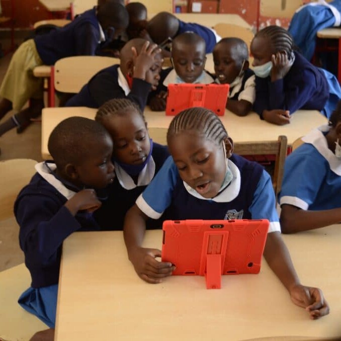Children learning on a tablet